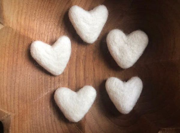Snowberry White felted wool hearts showing their organic, non-uniform shapes