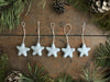 Set of five Morning Blue needle-felted wool star ornaments