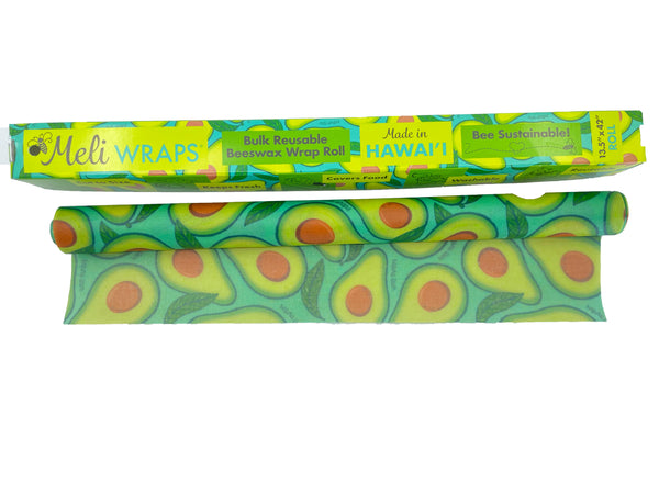Meli Wraps beeswax wrap bulk roll with avocado print being cut to a custom size