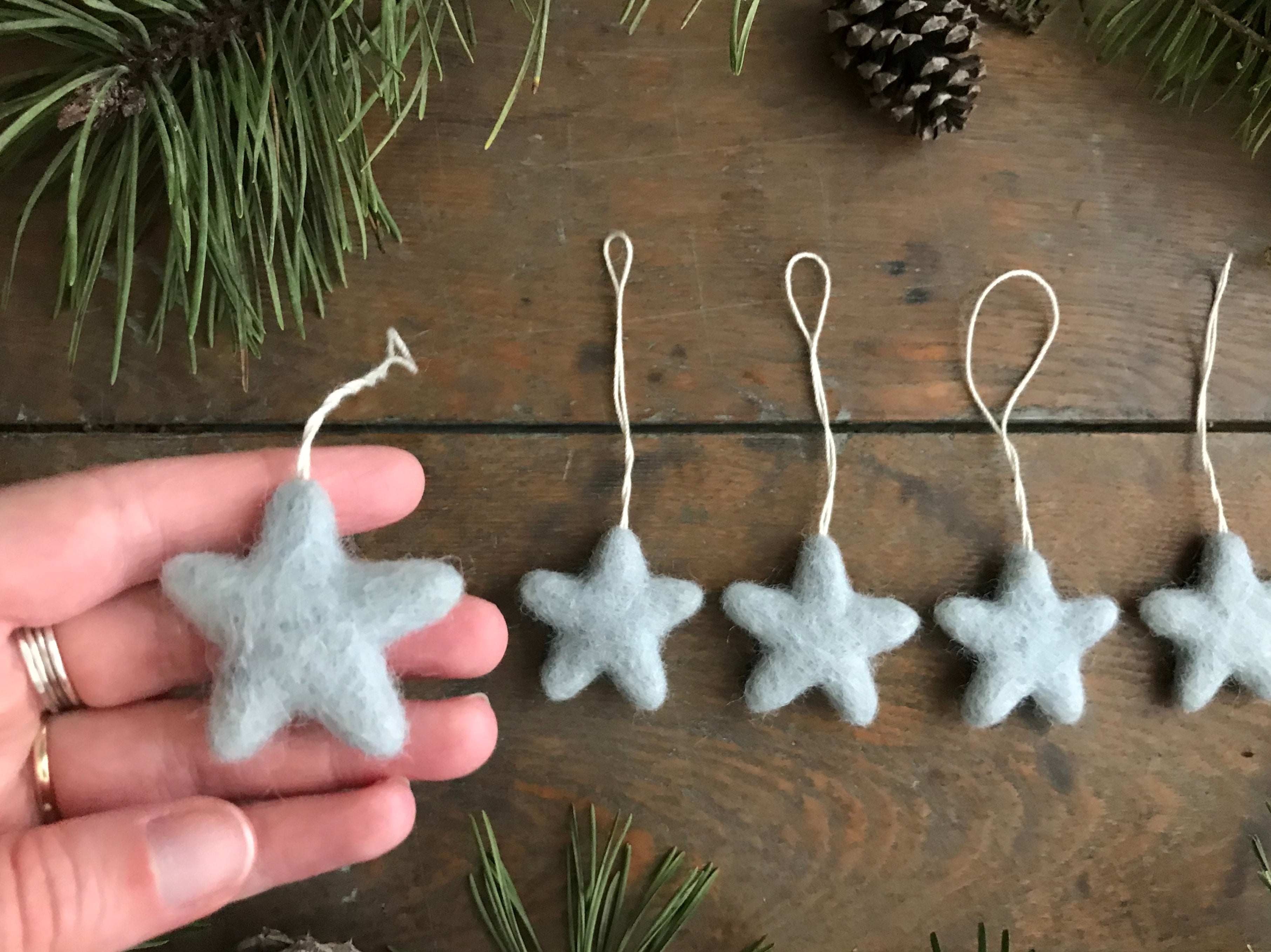 Morning Blue wool star ornaments with cotton string hanging loops