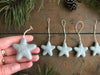 Morning Blue wool star ornaments with cotton string hanging loops