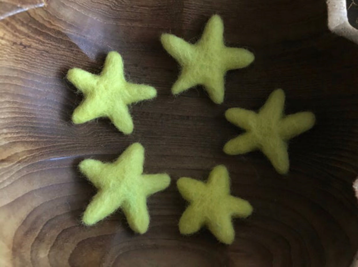 Mahonia Yellow felted wool stars showing their varied, organic shapes