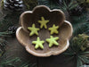 Handmade felted wool star set in Mahonia Yellow for decor or gifting