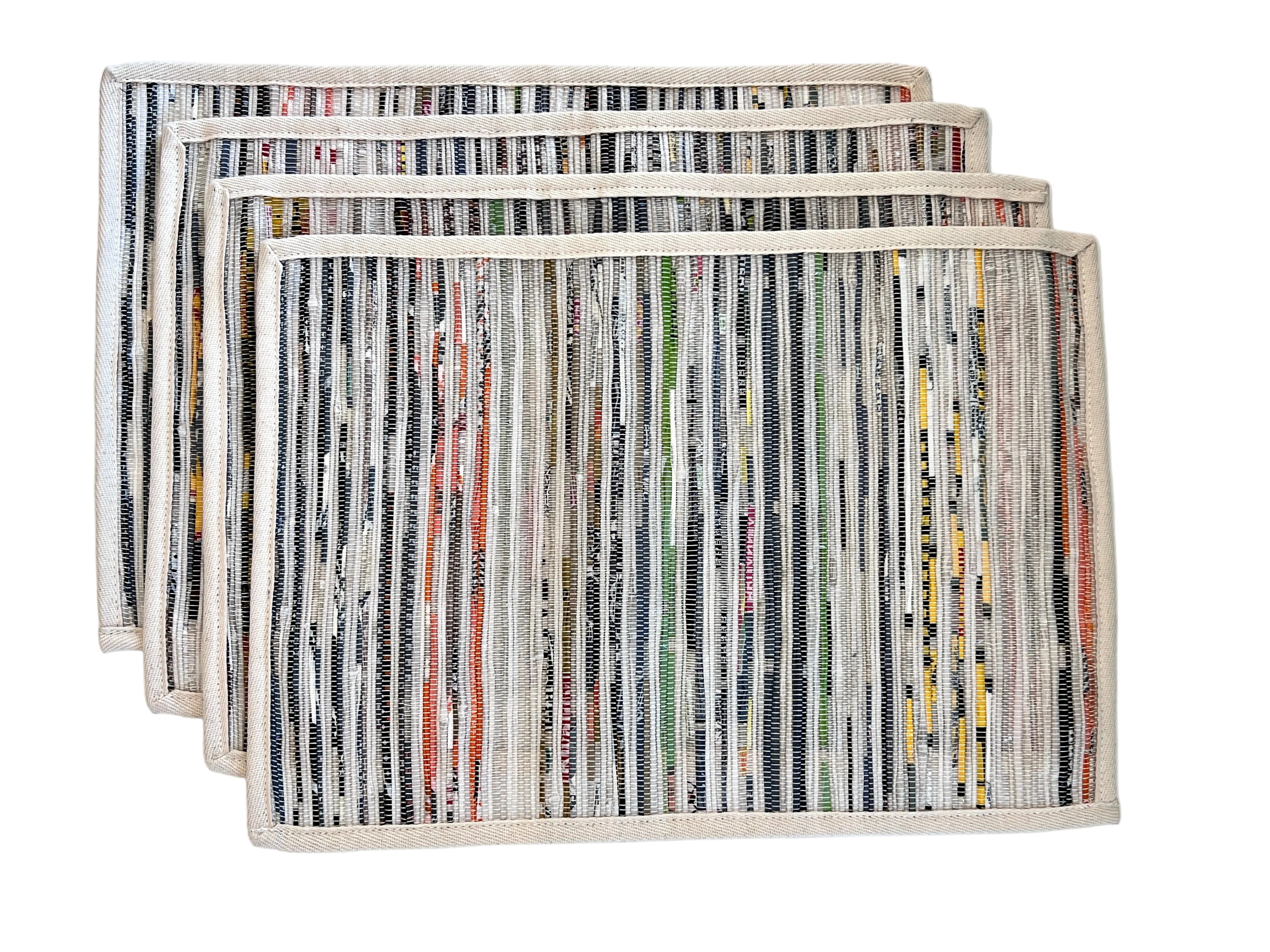 Set of 4 reversible upcycled plastic placemats laid flat showing woven texture and colour variation