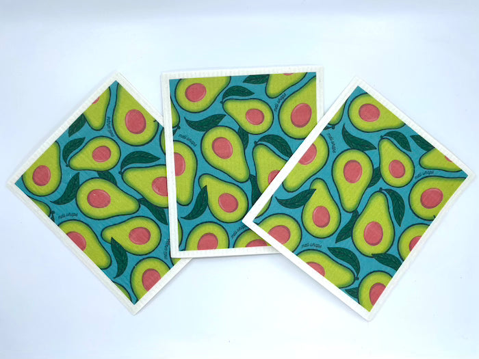 Avocado print Swedish dish cloth being used to wipe a surface