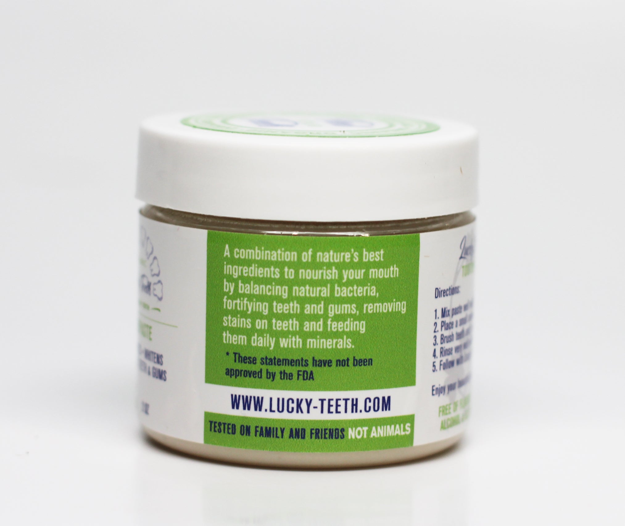 Lucky Teeth organic toothpaste jar showing texture and consistency