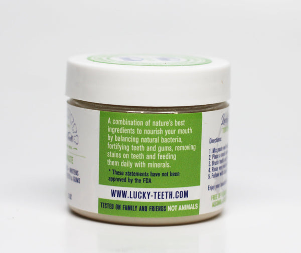 Lucky Teeth organic toothpaste jar showing texture and consistency