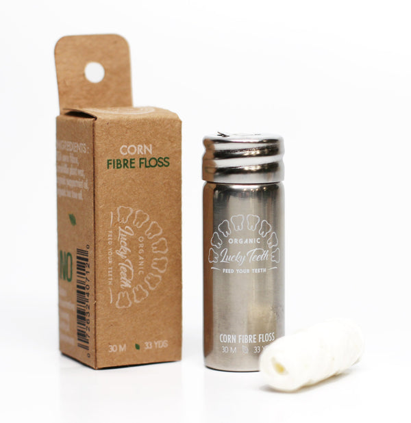 Corn fibre floss packaging with Lucky Teeth branding on a white background