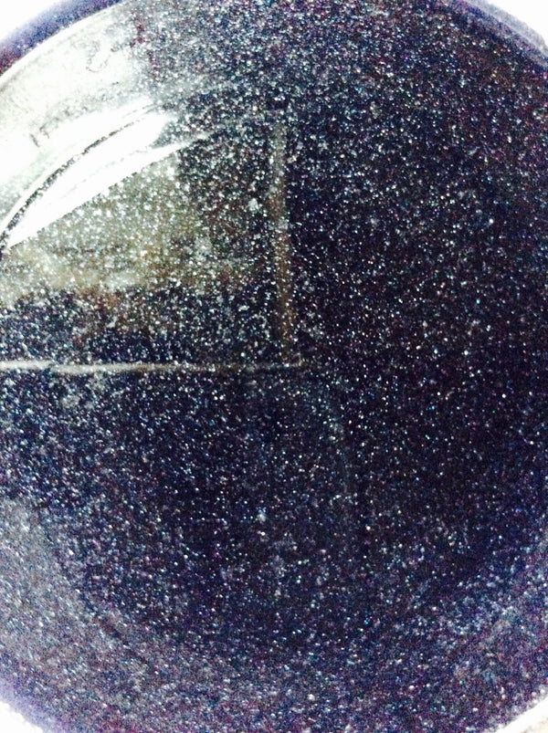 Close-up of a dark, textured surface with a triangular cutout