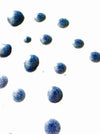 Blue glittery bubbles on a white background