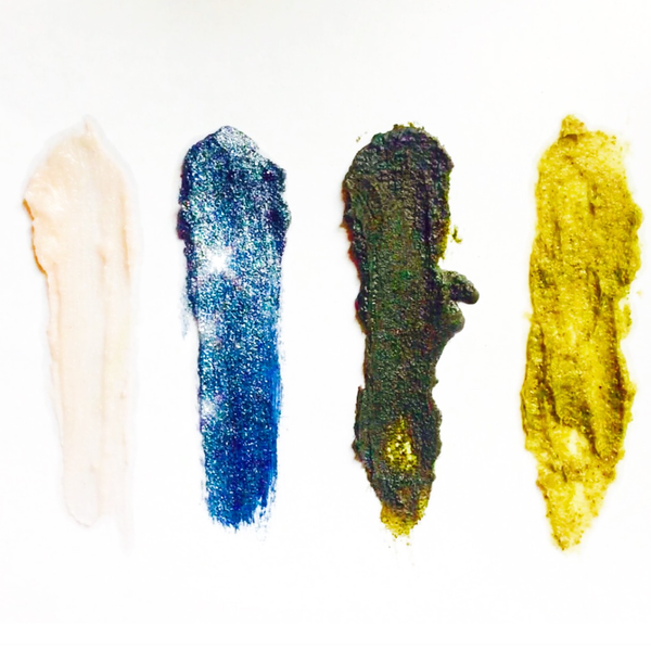 Four different colored makeup swatches on a white background
