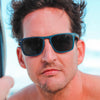 Joycoast Blu Wayfinder wooden sunglasses with blue polarized lenses on model