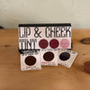 Lip and cheek tint set with three color samples on a wooden surface