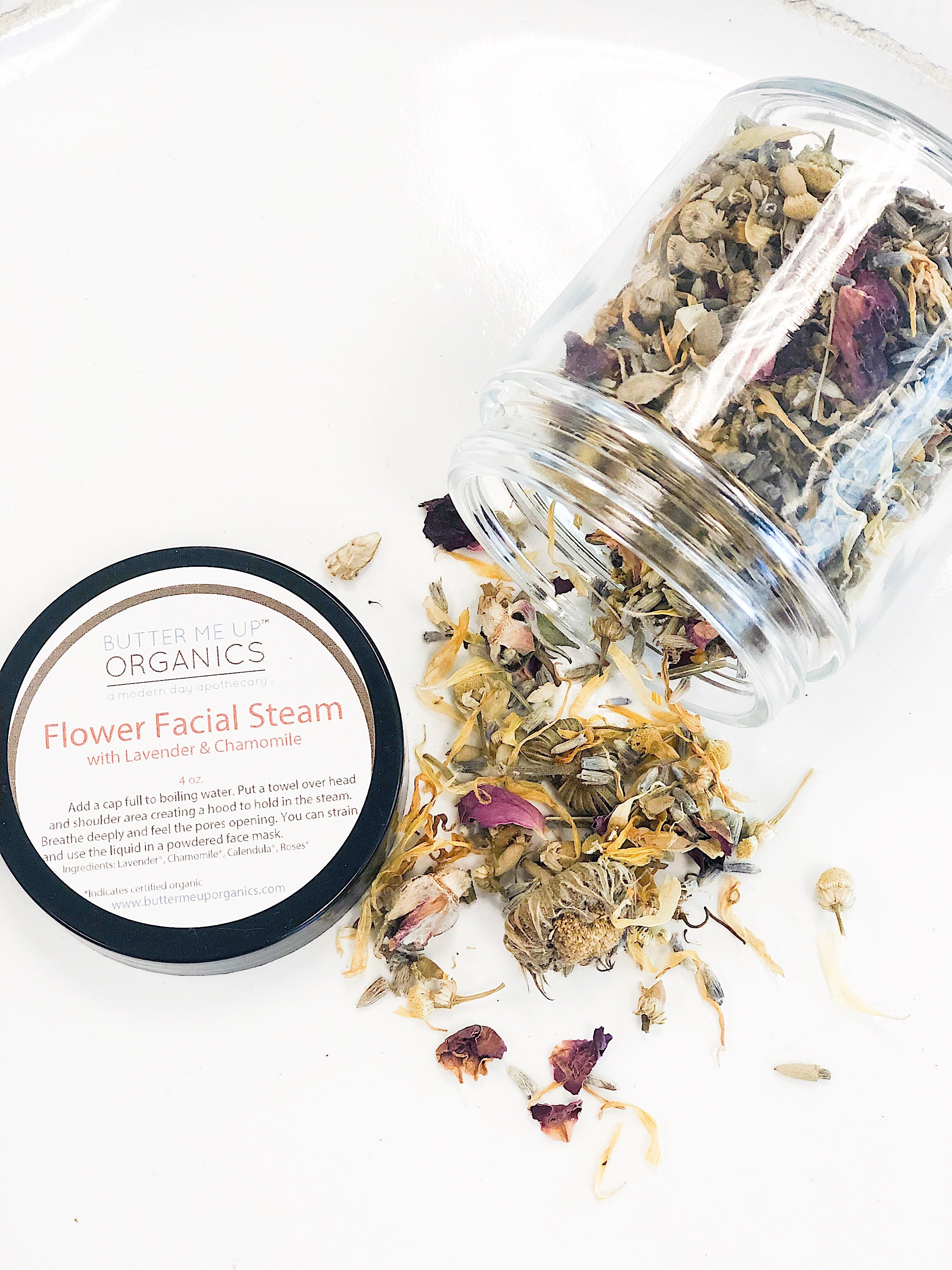 Calming Healing Facial Steam by Butter Me Up Organics displayed with natural ingredients and flowers