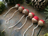 Felted wool acorn ornaments in varied sizes, part of a set of six