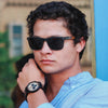 Man wearing Terra mixed wood wayfinder sunglasses by Joycoast outdoors in natural light