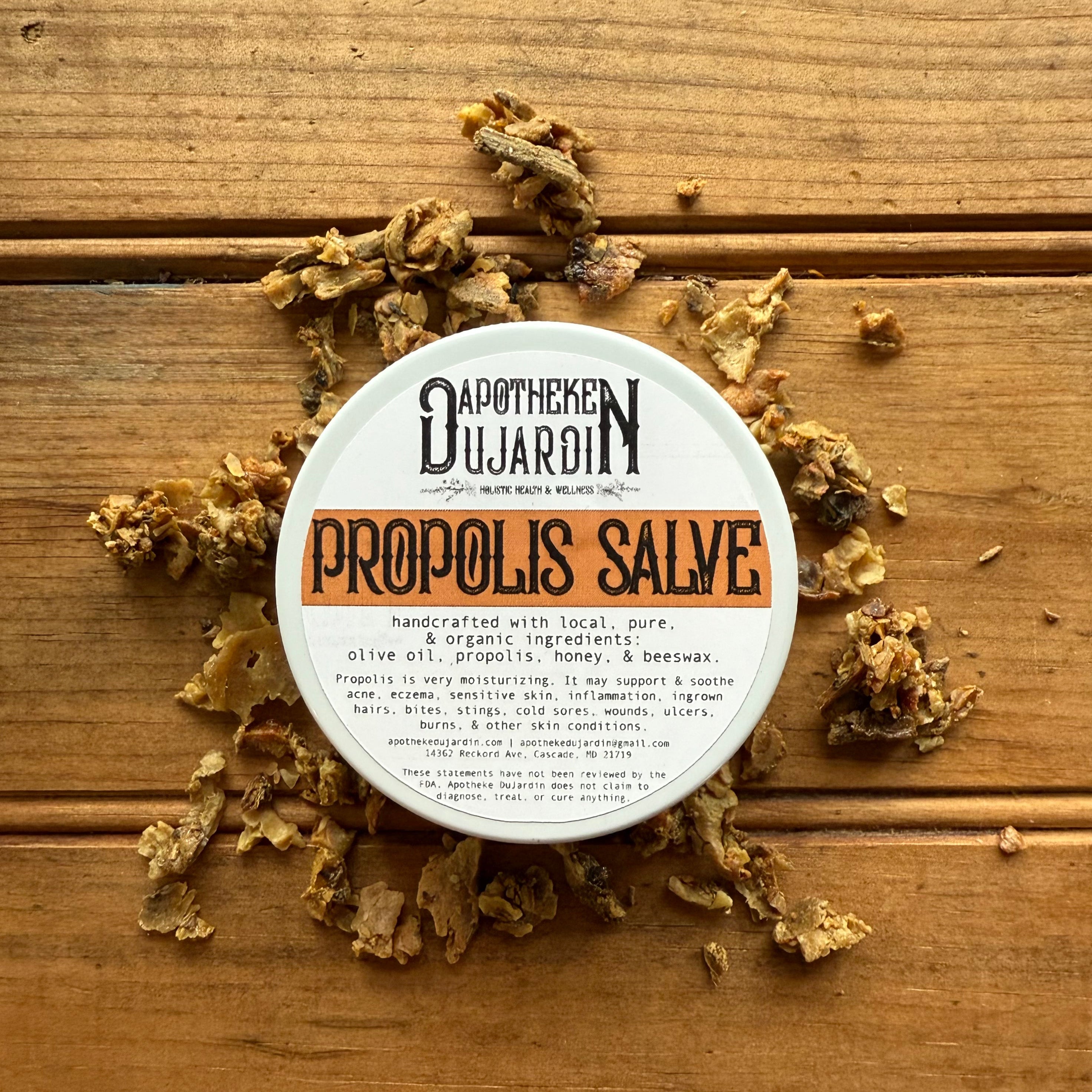 Apotheke DuJardin Propolis Salve in a 2 oz tin with local beeswax, honey, and olive oil on a natural background