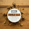 Apotheke DuJardin Propolis Salve in a 2 oz tin with local beeswax, honey, and olive oil on a natural background