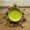 Close-up of Propolis Salve tin by Apotheke DuJardin showing natural texture and handcrafted quality