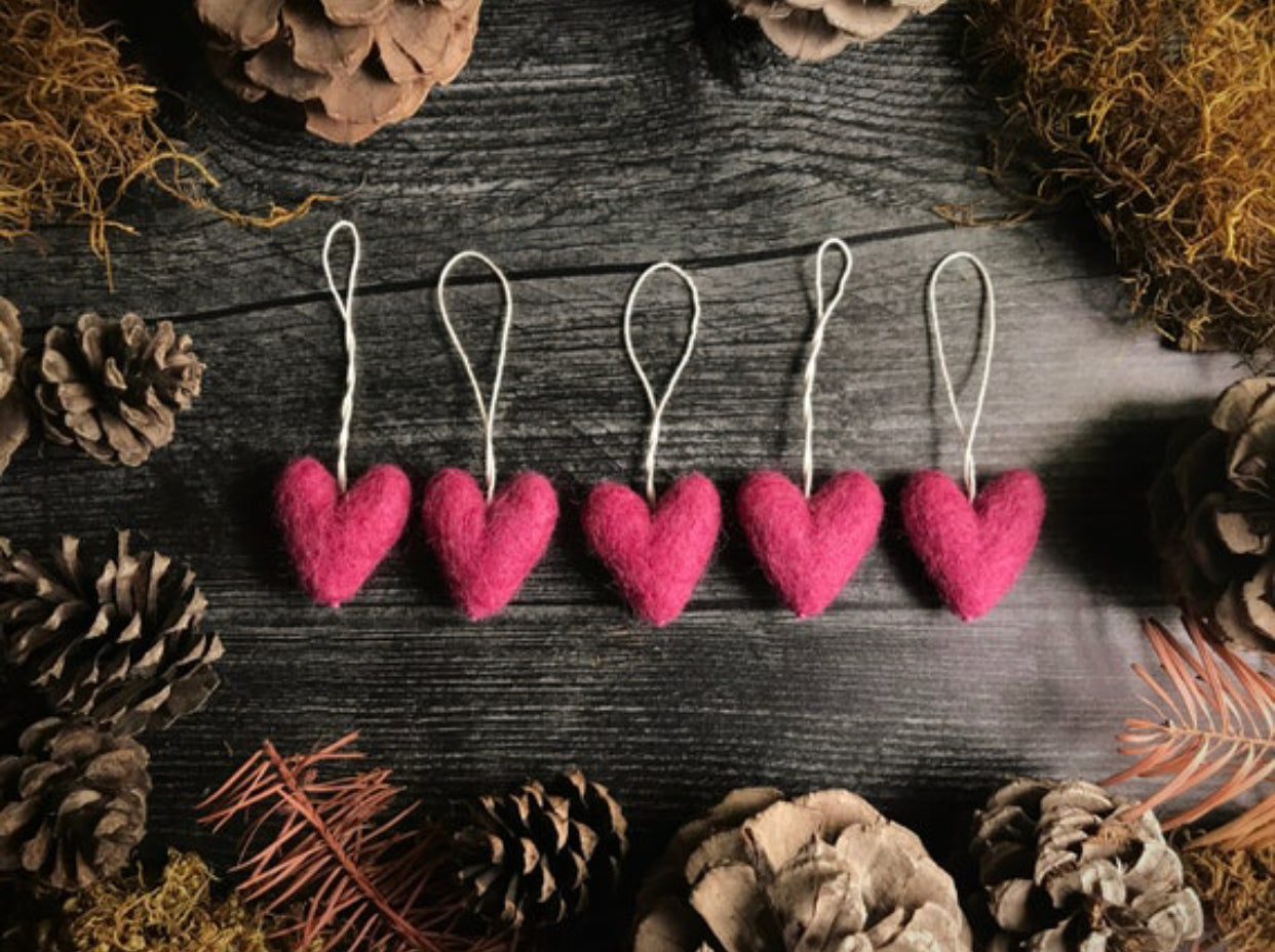 Set of five Wild Rose Pink needle-felted wool heart ornaments with cotton string loops