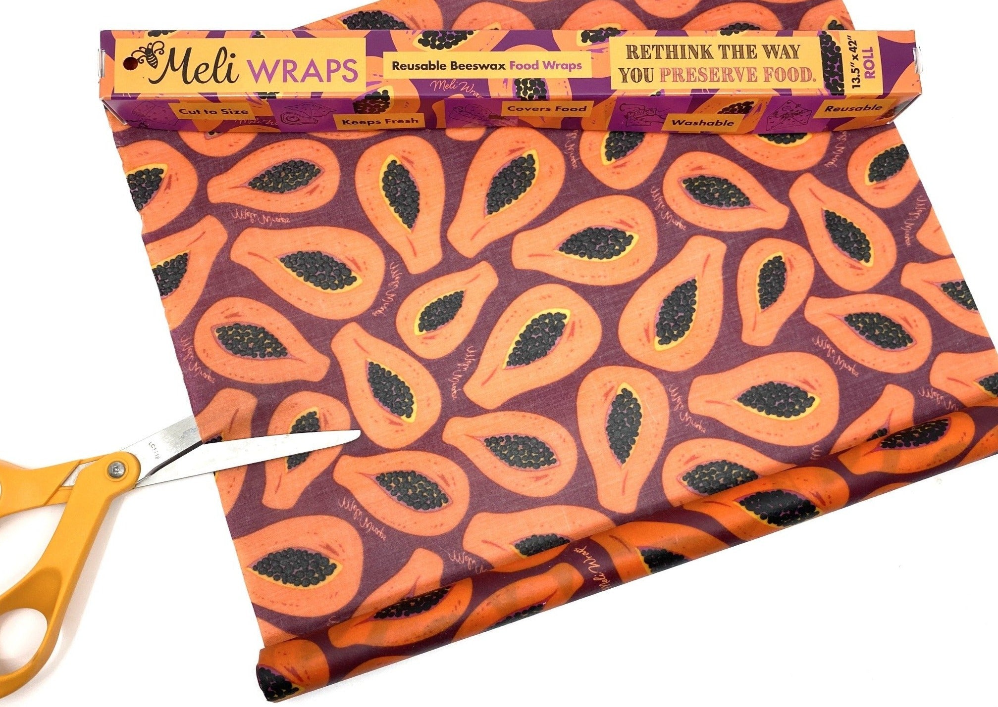 Meli Wraps with papaya design and scissors on a white background