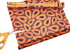 Meli Wraps with papaya design and scissors on a white background