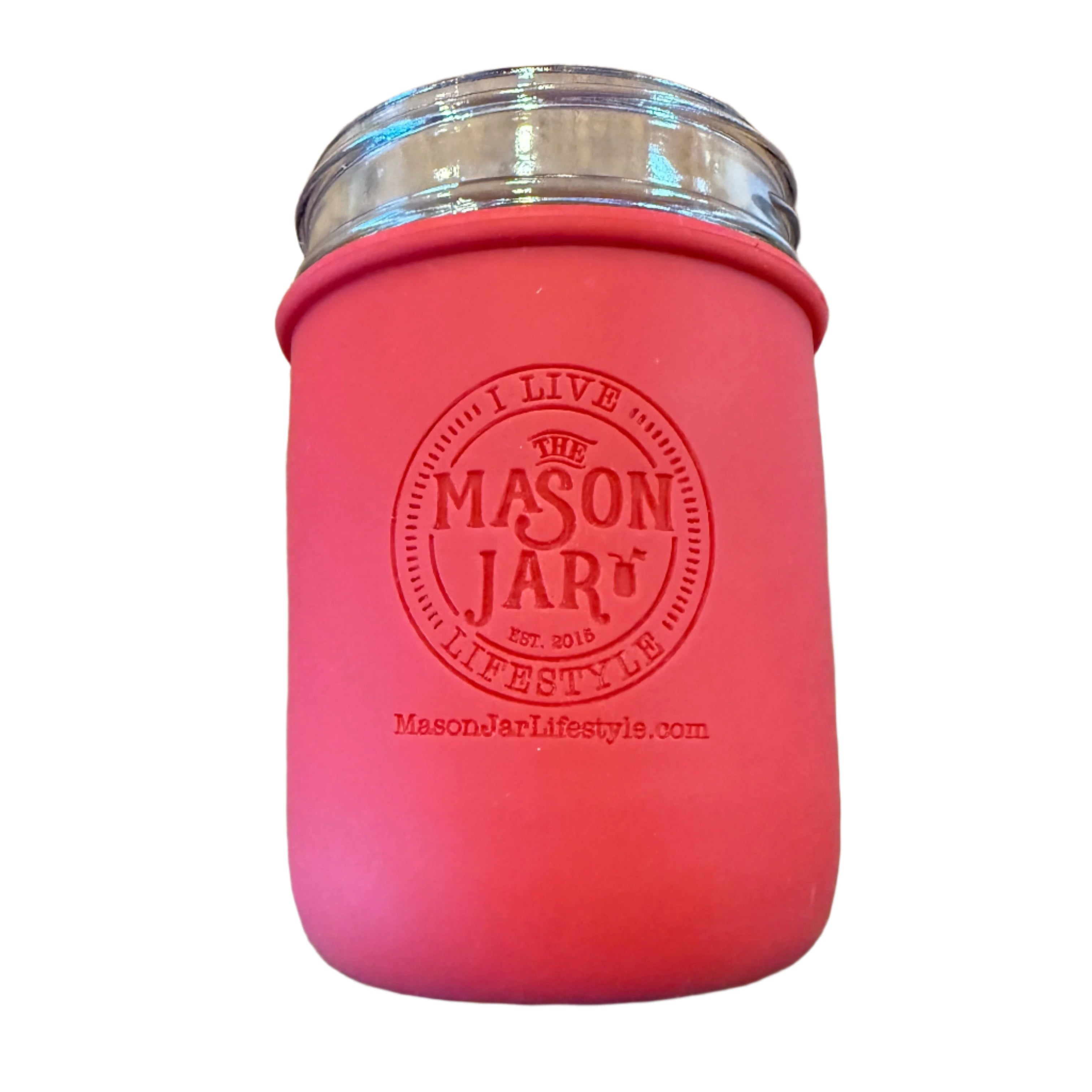 Pink mason jar with silver lid on a white background