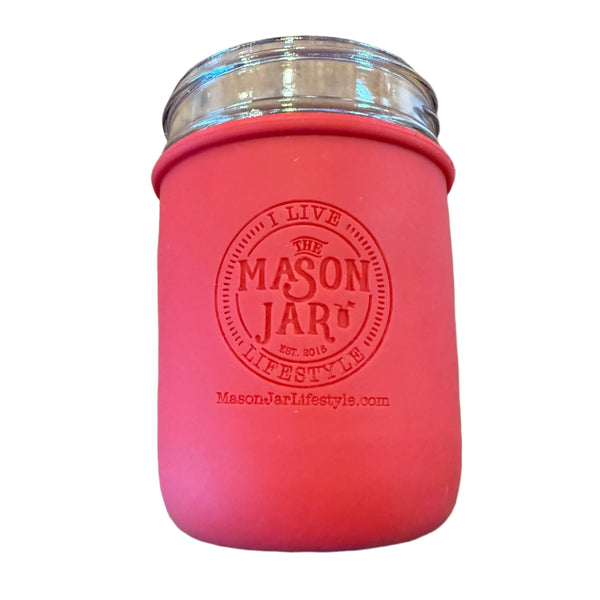 Pink mason jar with silver lid on a white background