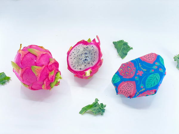 Dragon fruit with a colorful packaging on a white background