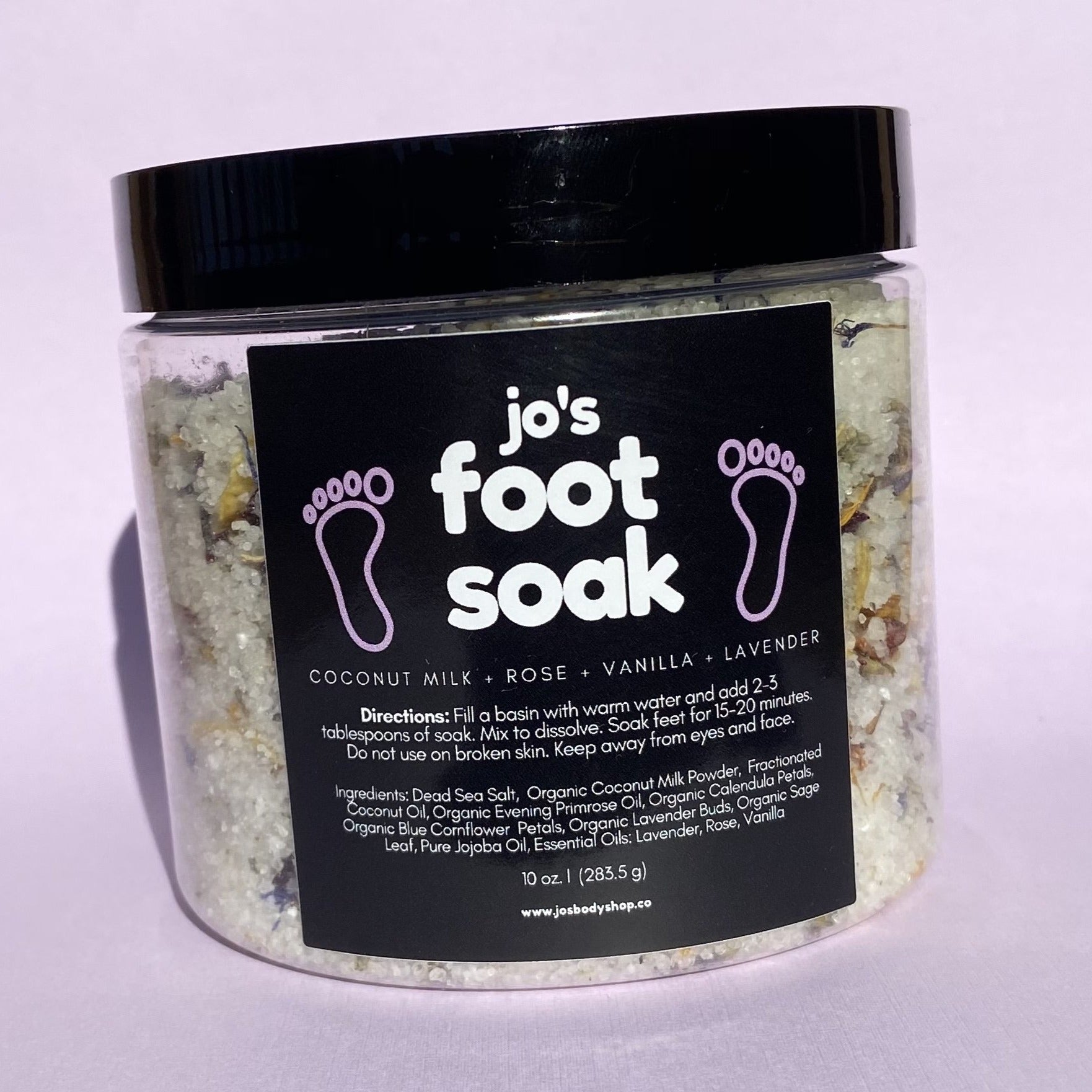 Jo's Flower and Herb Foot Soak in a glass jar with organic lavender, calendula, and blue cornflower botanicals