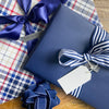 EverBox navy blue reusable gift box styled as a wrapped present, ideal for birthdays and special occasions
