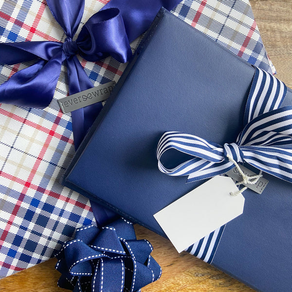 EverBox navy blue reusable gift box styled as a wrapped present, ideal for birthdays and special occasions