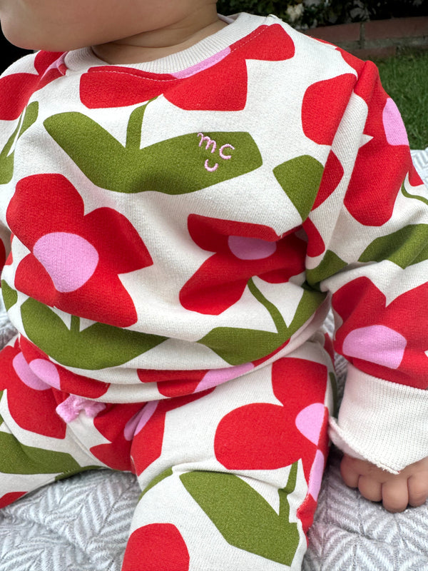 Baby wearing Mon Coeur floral sweatshirt – relaxed fit with dropped shoulders and ribbed hem