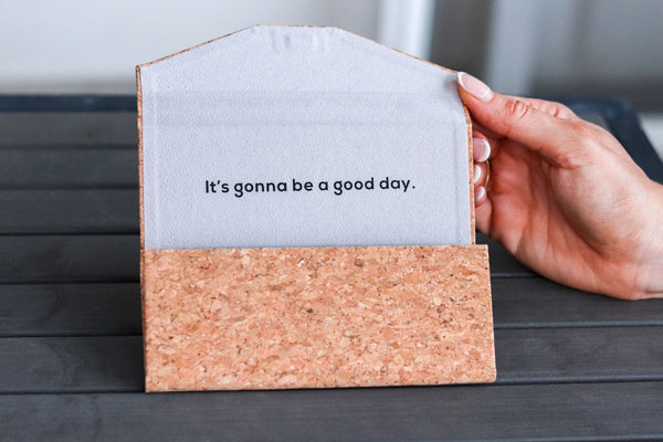 Cork folding sunglasses case holding a pair of sunglasses, one size fits all