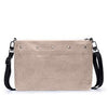 Beige handbag with black strap on a white background