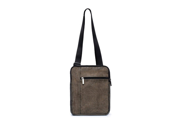 Brown leather crossbody bag with a black strap on a white background