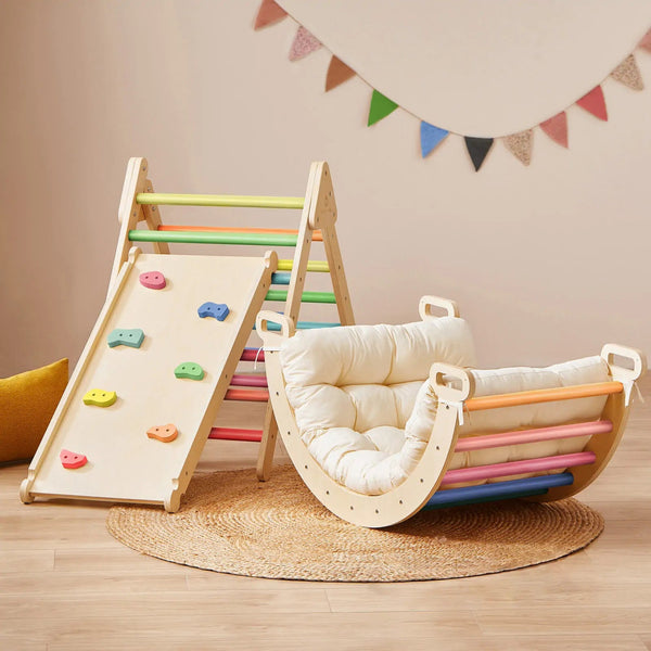 Children's play area with a colorful climbing toy and a wooden swing on a wooden floor.