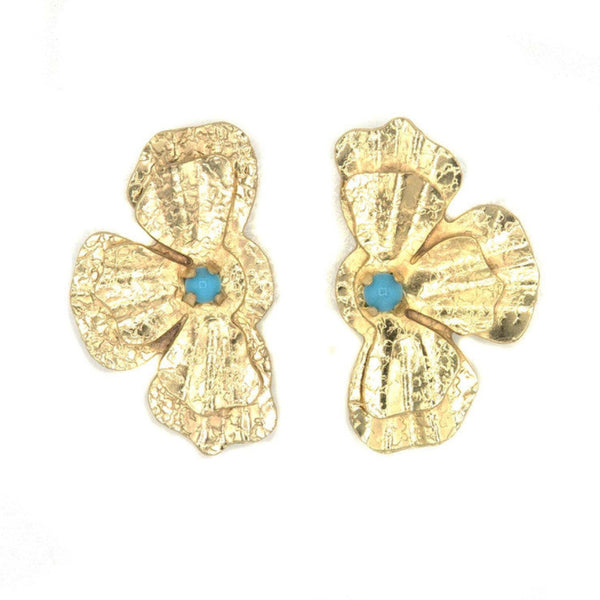 In Bloom stud earrings by Fair Anita — flower-shaped recycled brass studs with teal stone accent
