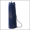 OMSutra Indigo Denim Yoga Mat Bag with hand-embellished OM rivet design, cotton twill, pull-cord closure and grommet ventilation