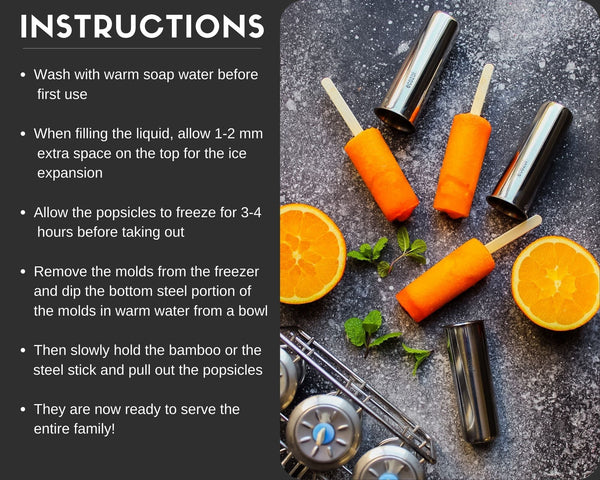 Orange popsicles with metal molds on a dark surface, accompanied by cleaning instructions.
