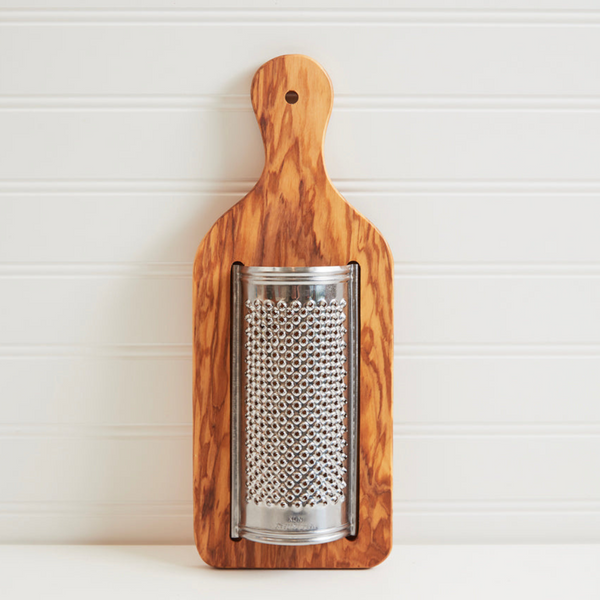 Elevate your pasta night with the Verve Culture Italian Olivewood Flat Cheese Grater. Handcrafted in Italy, this grater features a sharp stainless steel grater and a beautiful olivewood handle, perfect for serving fresh cheese tableside.