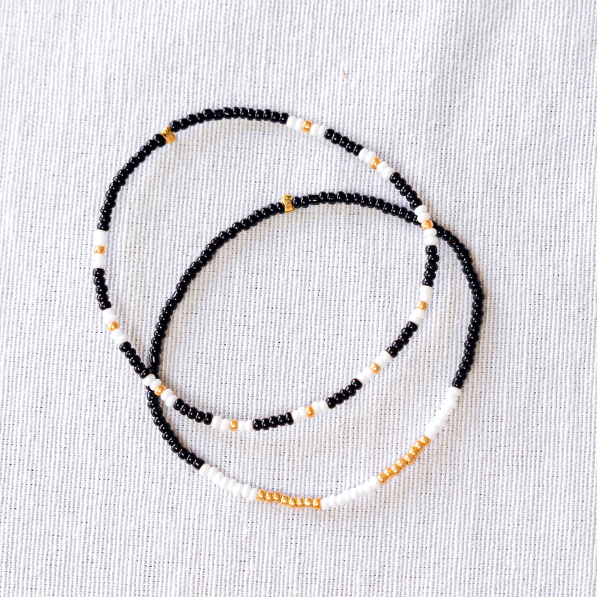 These stunning seed bead bracelets are not only stylish but also ethically made. Perfect for any occasion, they're a great way to support fair trade and sustainable fashion.