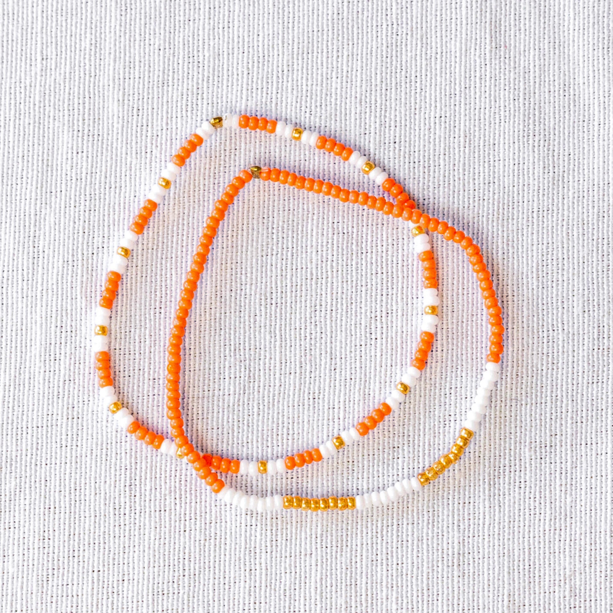 These stunning seed bead bracelets are not only stylish but also ethically made. Perfect for any occasion, they're a great way to support fair trade and sustainable fashion.