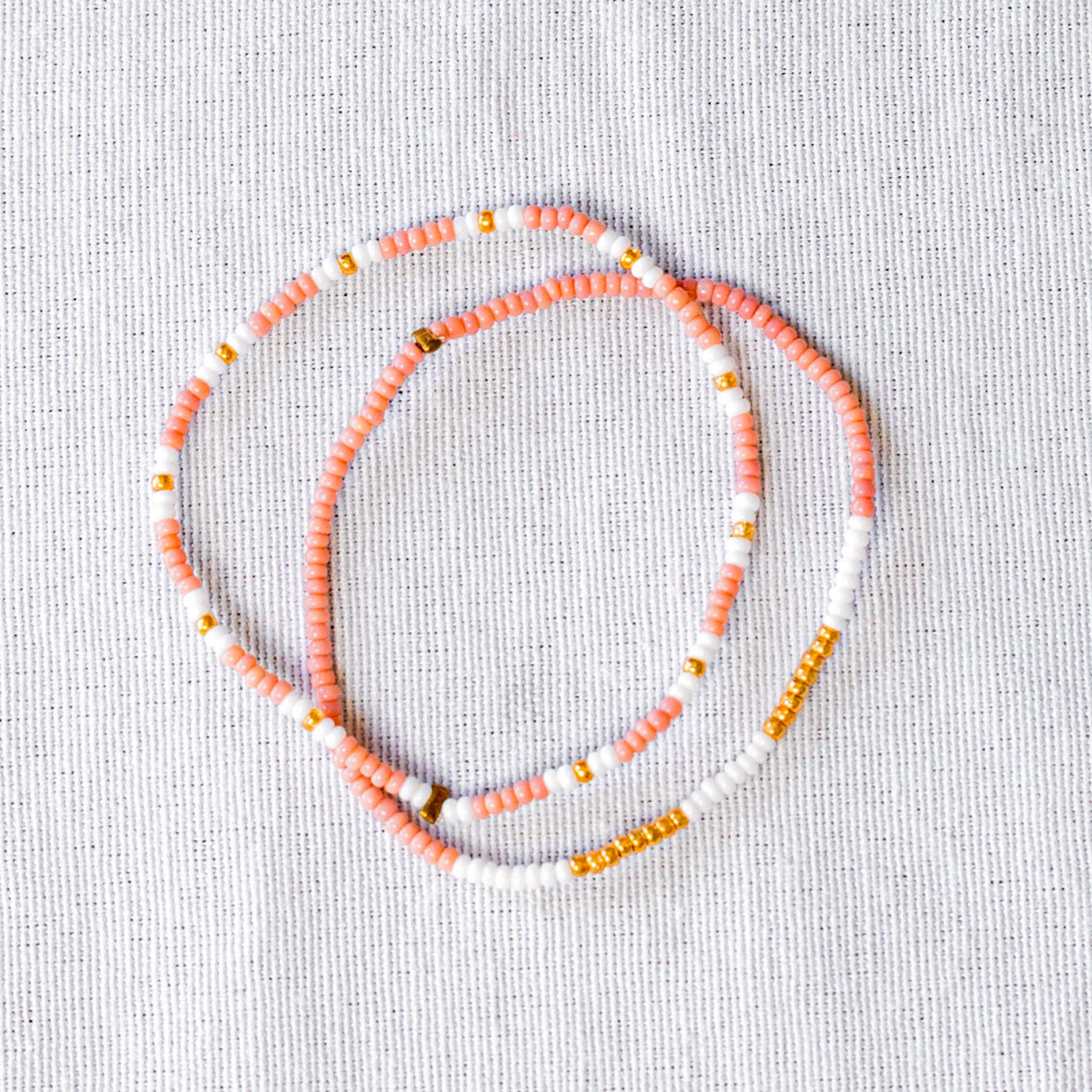 These stunning seed bead bracelets are not only stylish but also ethically made. Perfect for any occasion, they're a great way to support fair trade and sustainable fashion.