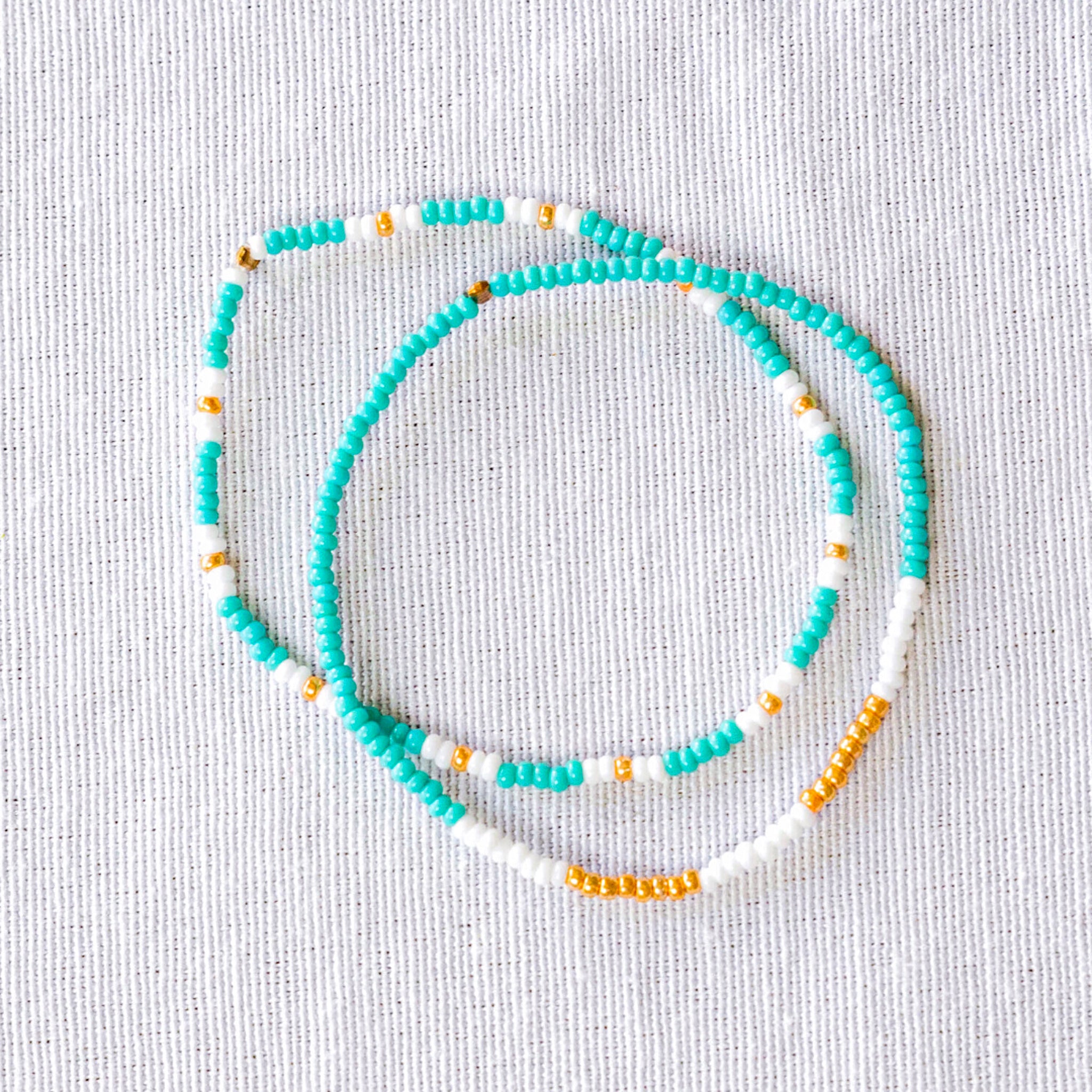 These stunning seed bead bracelets are not only stylish but also ethically made. Perfect for any occasion, they're a great way to support fair trade and sustainable fashion.