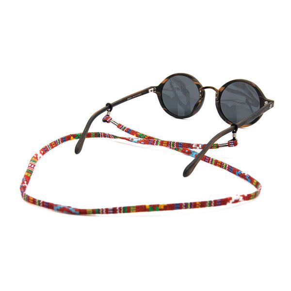 Sunglasses with a colorful beaded strap on a white background