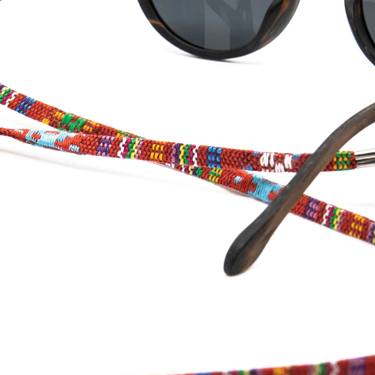 Sunglasses with colorful beaded strap on a white background