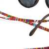 Sunglasses with colorful beaded strap on a white background