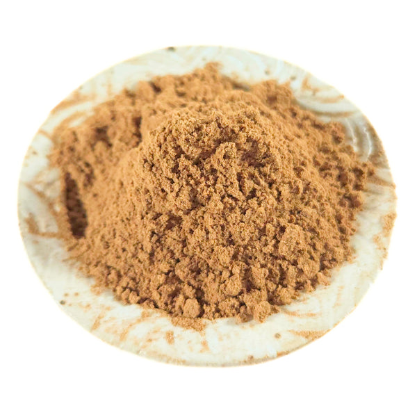Makko powder displayed alongside handmade incense cones showing its use as a binder and base