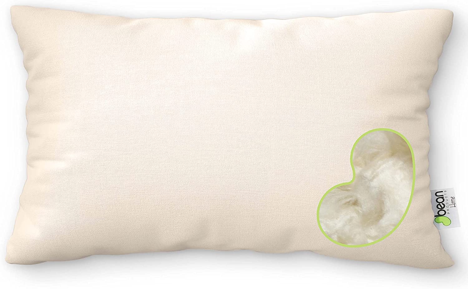 Beige pillow with a heart-shaped cutout revealing white stuffing on a white background
